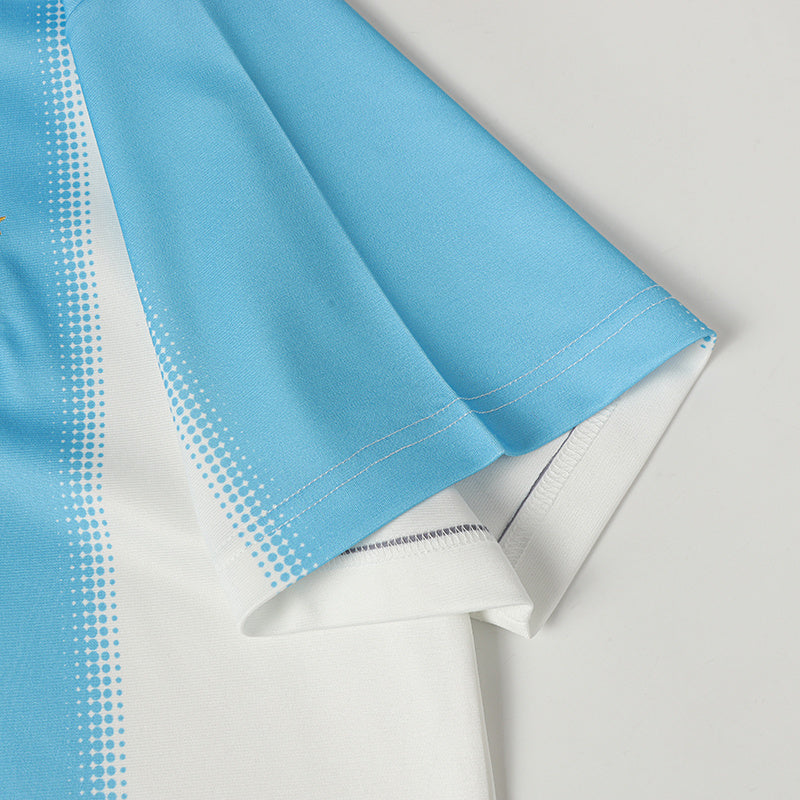 Light blue and white football jersey with vertical stripe detail and textured fabric close-up