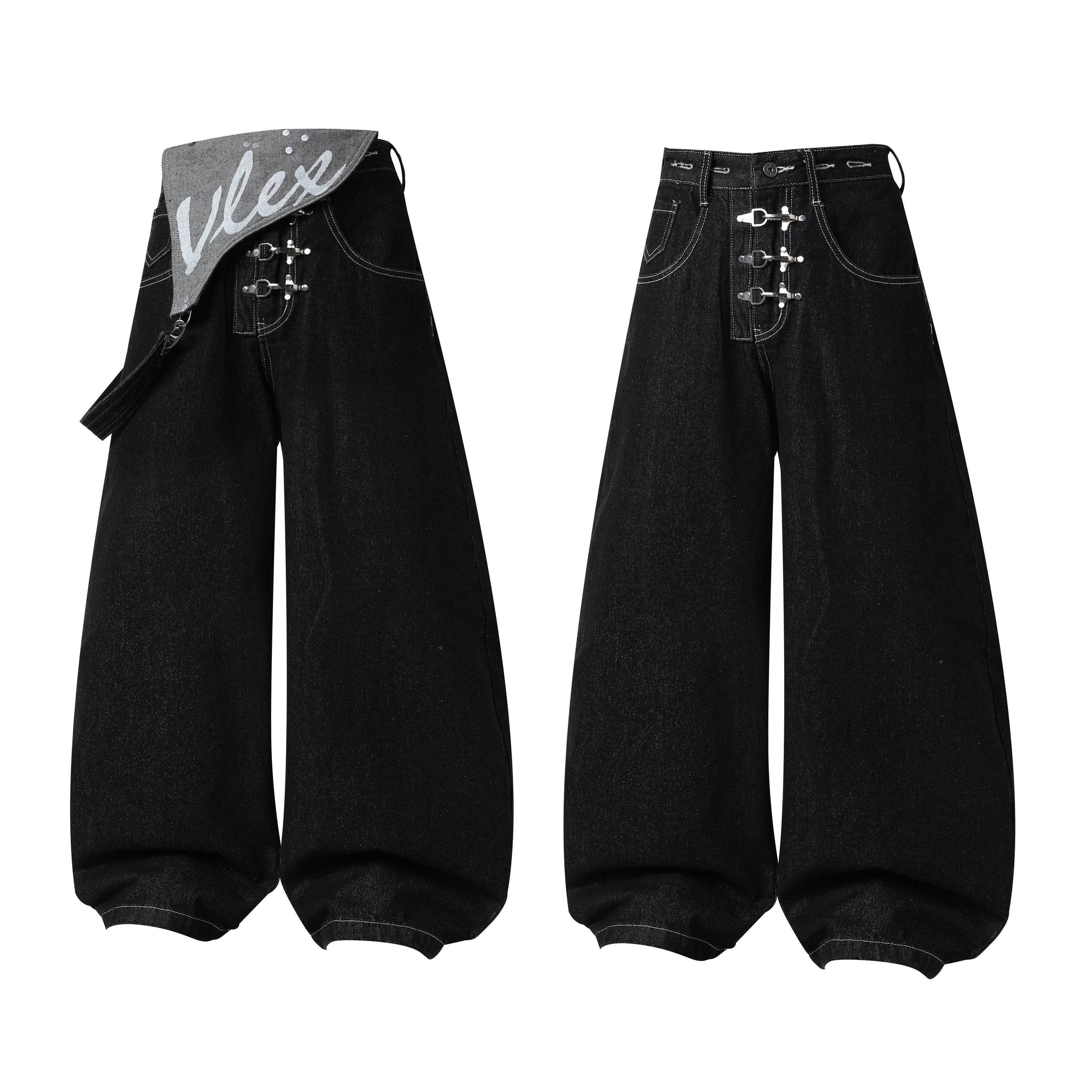 Black wide-leg jeans with asymmetric grey waist flap, metal buckle hardware, and contrast stitching, shown front and back