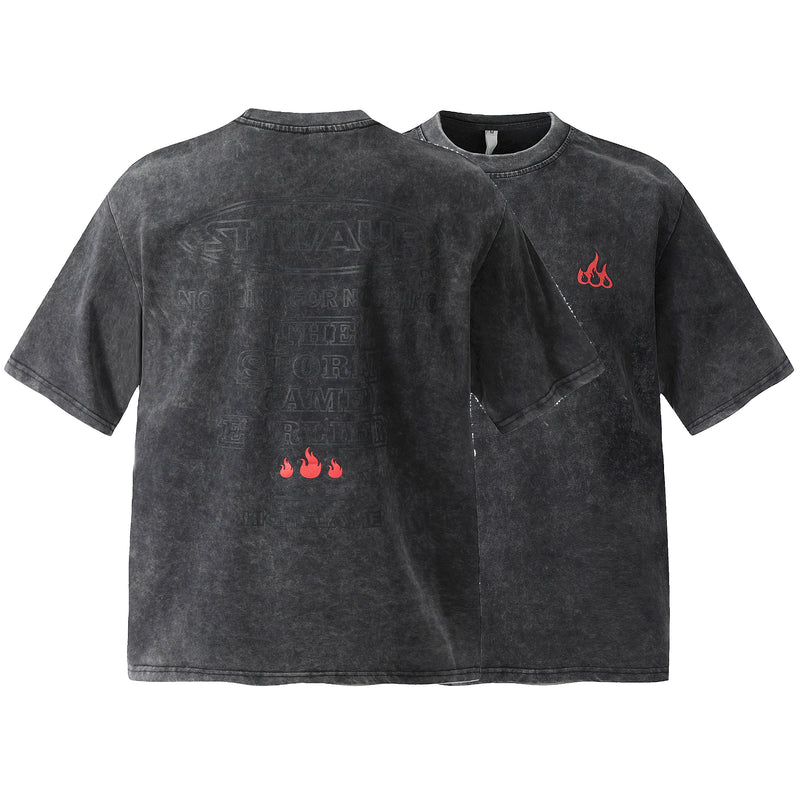 Washed black oversized cotton T-shirt with faded flame graphic and relaxed crewneck fit, front and back views on white background