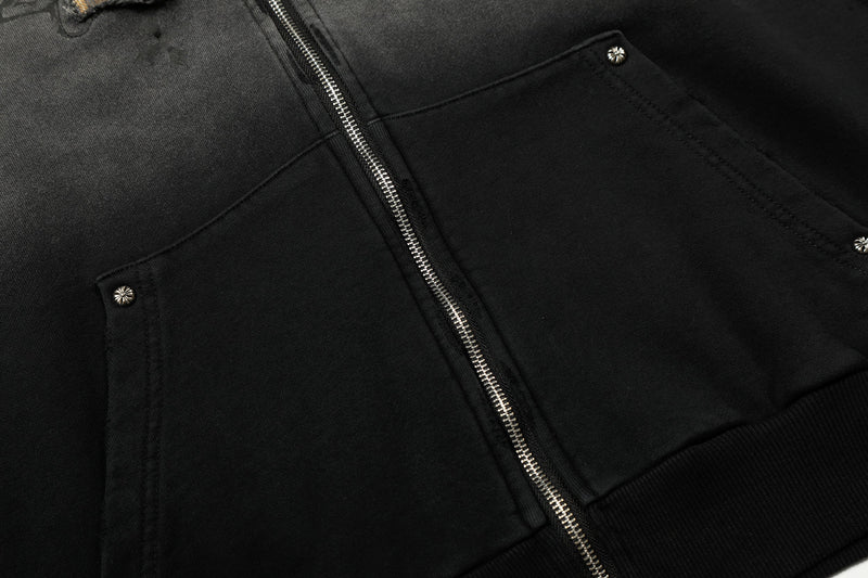 Close-up of black hoodie front pocket and silver snap button detail