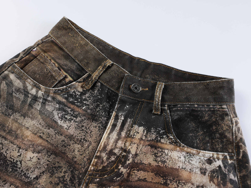 Front waist detail showing button closure, belt loops, and animal print denim