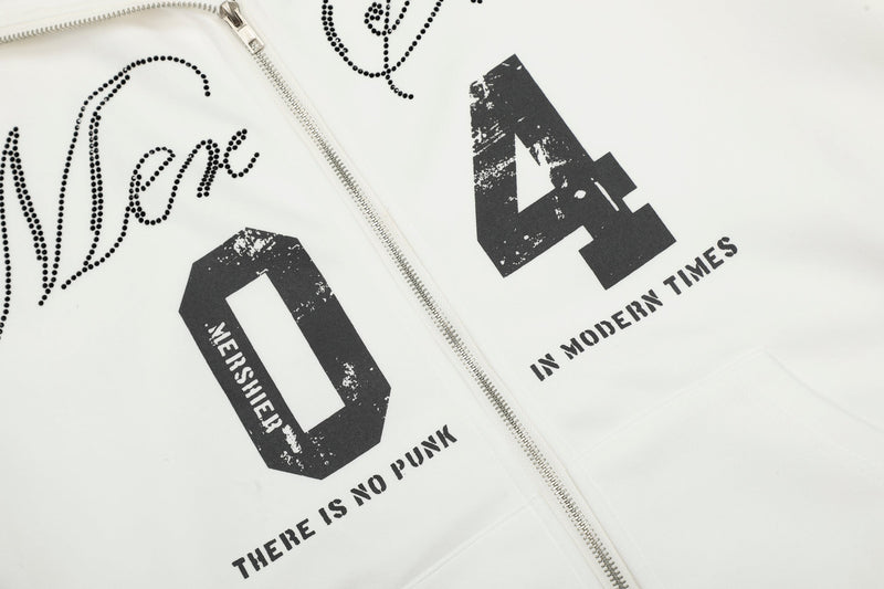 Close-up of front graphic on white hoodie with distressed black number print