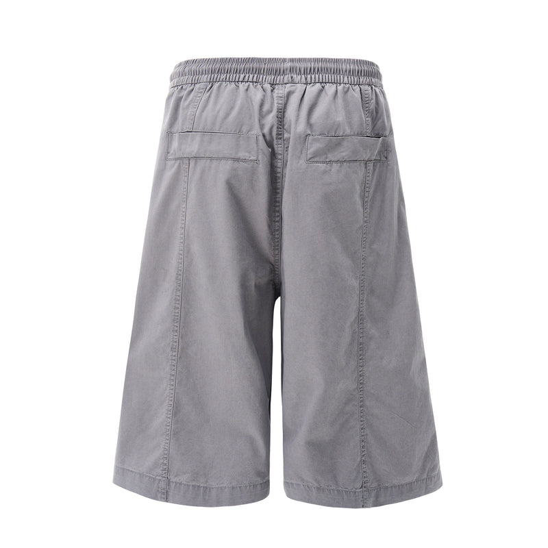 Back view of gray wide-leg shorts with elastic waist and two back patch pockets