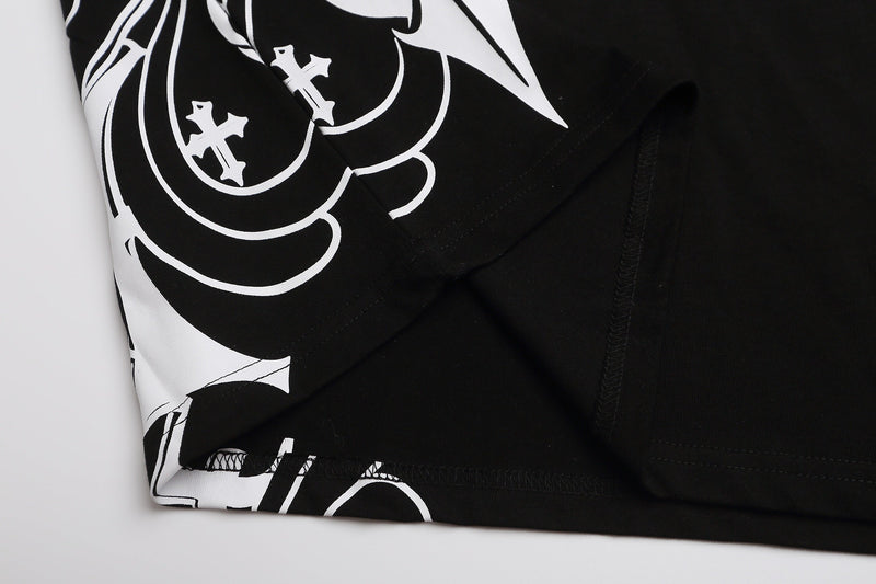 Close-up of black and white gothic cross print polo shirt with bold Y2K streetwear pattern and black collar detail