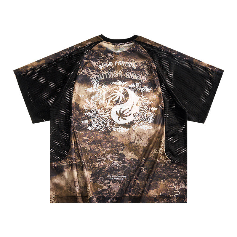 Seakoff graphic mesh performance tee with desert camo print, white graphic logo, and black perforated sleeves
