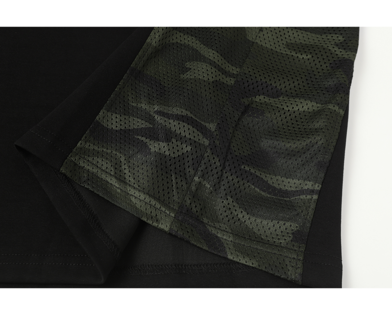 Close-up of camouflage mesh sleeve panel on black shirt