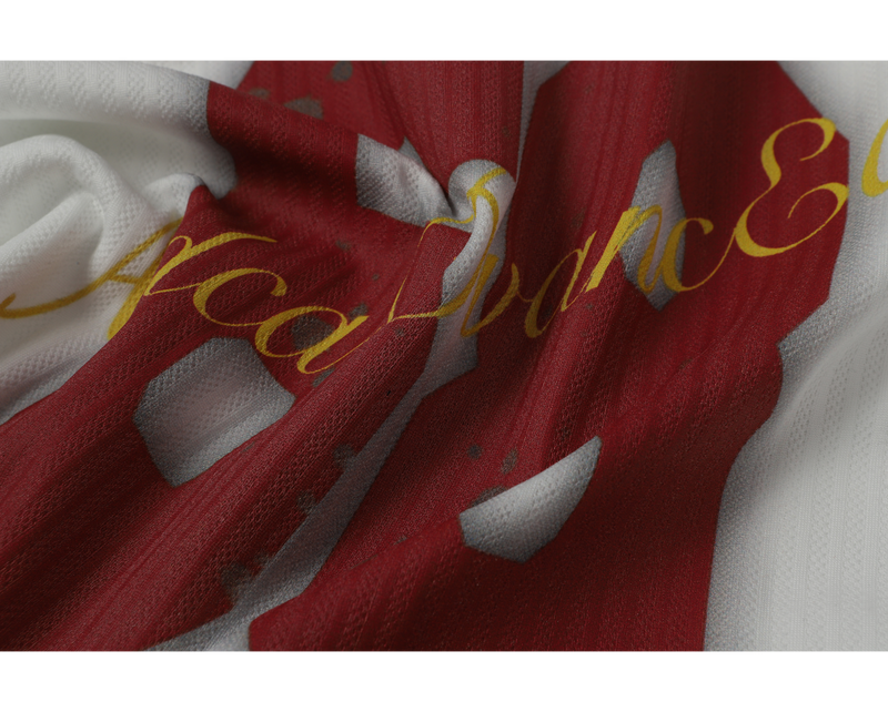 Close-up of gold script and red number graphic on mesh jersey fabric