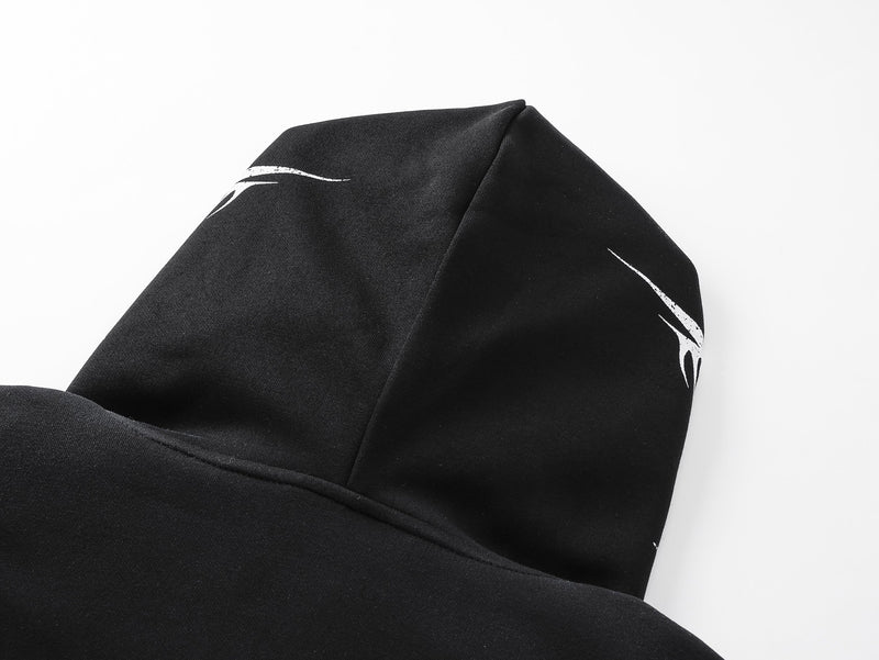 Close-up of hoodie hood in black fabric with white graphic print