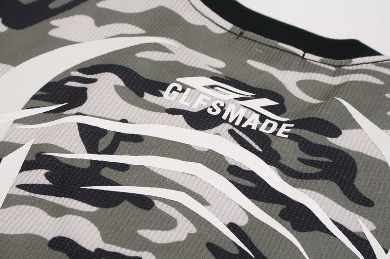 Close-up of front chest print reading GLFSMADE on olive camo waffle fabric