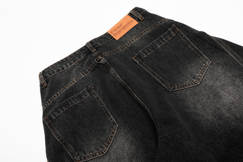 Back waistband and rear pockets on black vintage wash balloon jeans