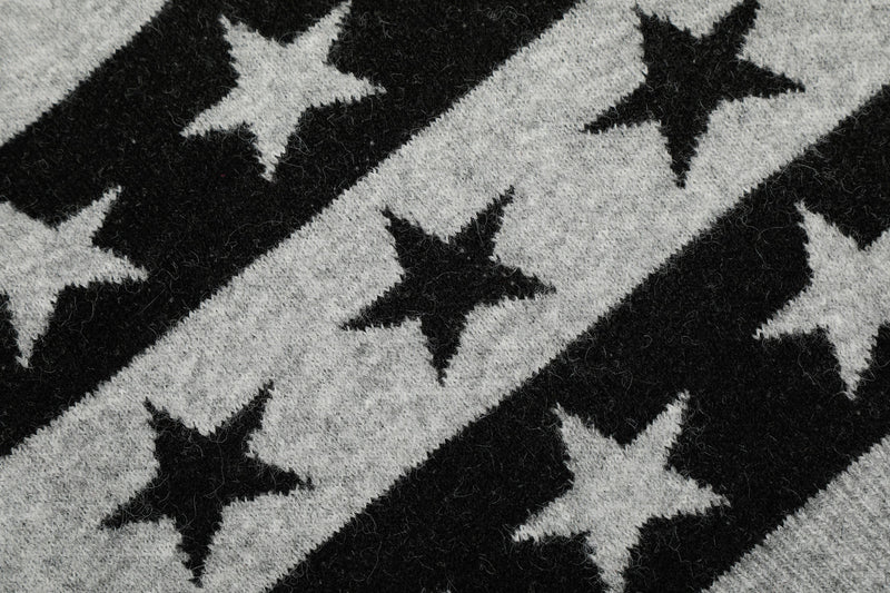 Close-up of black and gray knit fabric with star pattern