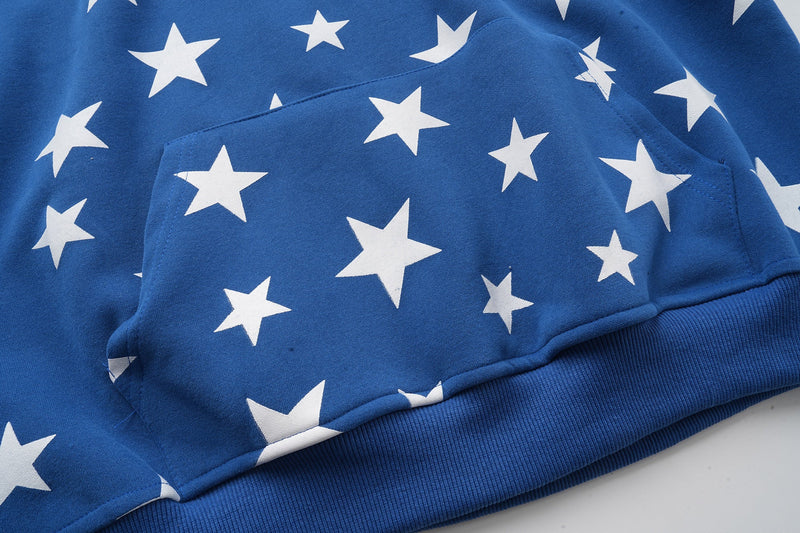 Blue star-print hoodie front pocket and ribbed hem close-up