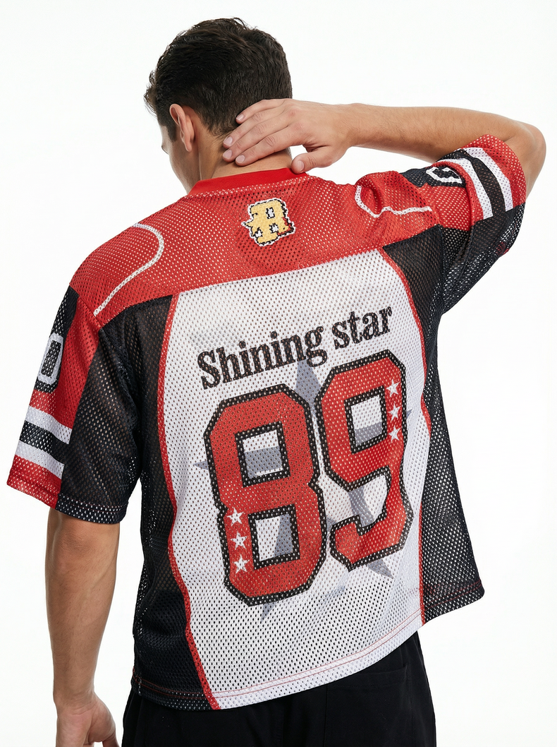 Man wearing red and black mesh football jersey with Shining Star 89 graphic on the back