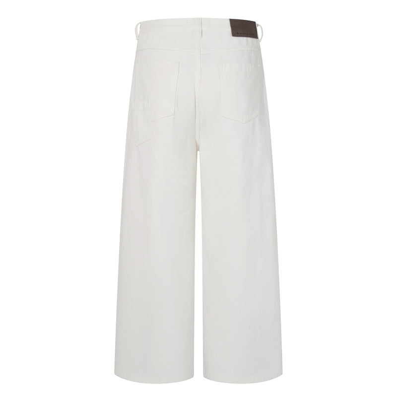 Back view of white wide-leg jeans with patch pockets and a brown waistband label