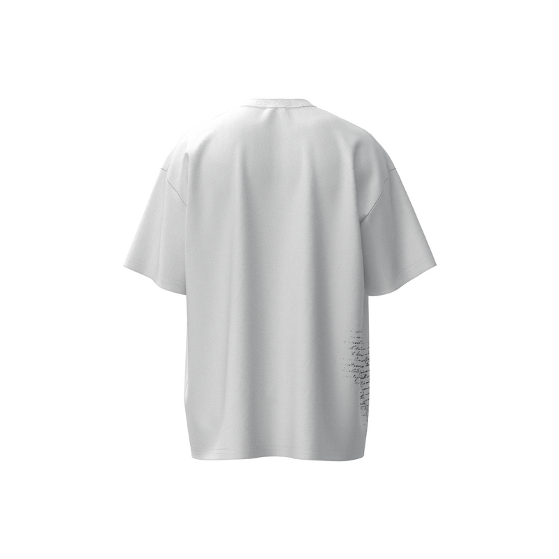 White oversized cotton streetwear tee with subtle black script detail on the lower back hem