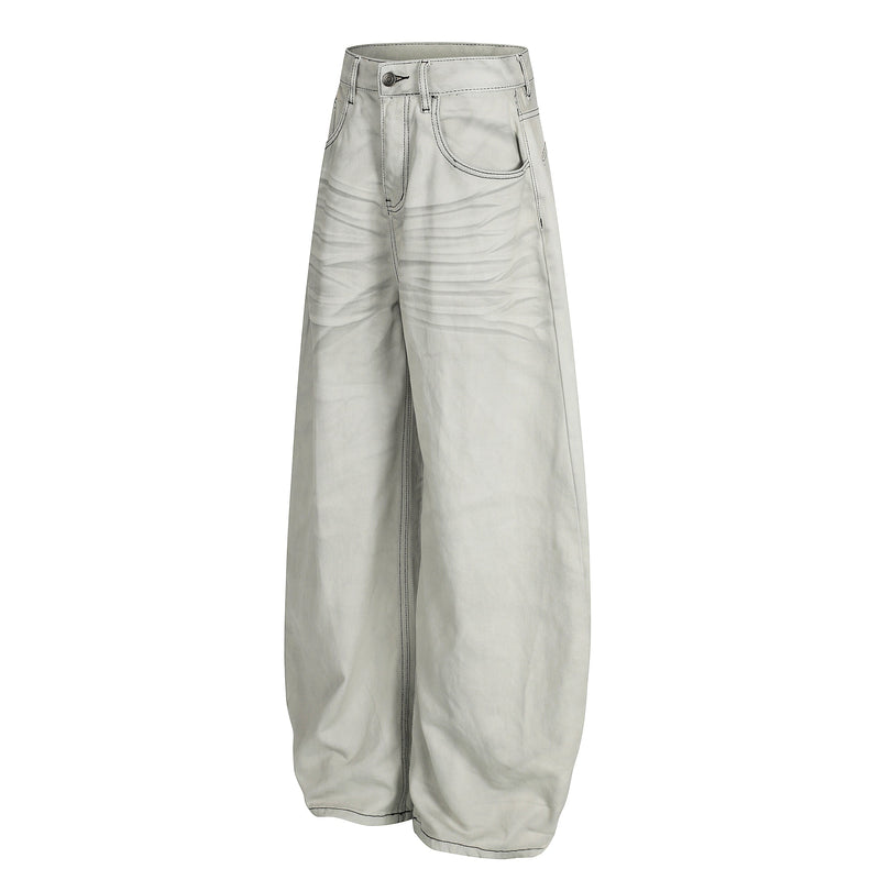 Side view of light gray ultra wide-leg jeans showing contrast stitching and wide leg shape
