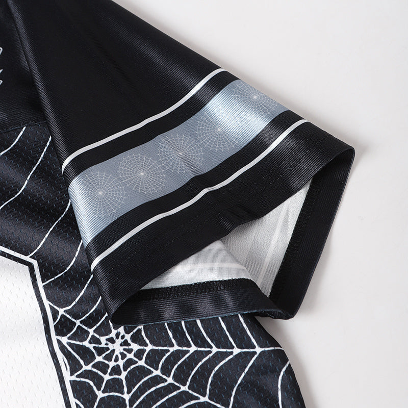 Black football jersey sleeve with spider web graphics and silver stripe details on mesh fabric