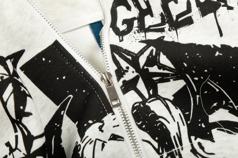 Close-up of white hoodie front zipper and black graphic print on fabric