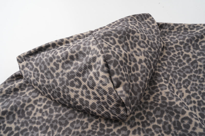 Side close-up of leopard print hood folded over the shoulder