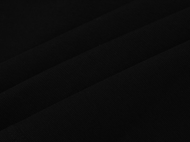 Close-up of black sweatshirt fabric texture with diagonal woven knit pattern
