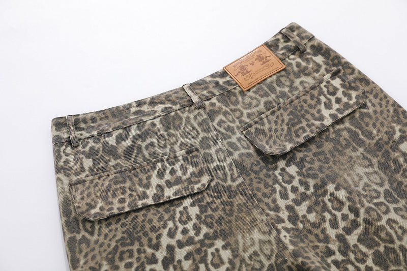 Back waistband detail of leopard print cargo shorts with leather logo patch and rear pockets