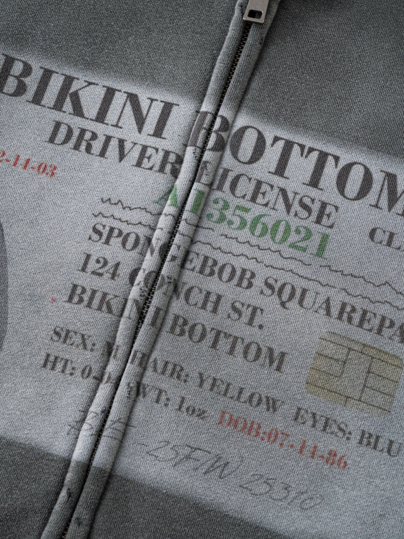 Close-up of gray hoodie front print with Bikini Bottom driver license design