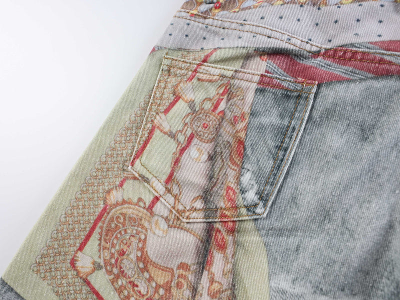 Back pocket close-up on pale patchwork denim with printed details