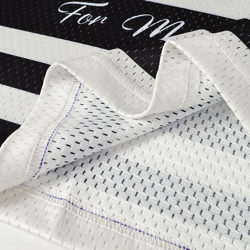 White mesh football jersey fabric with black and purple stitching details and a bold varsity-style graphic print