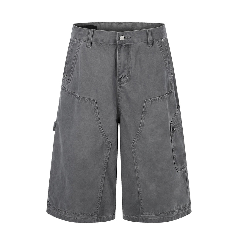 Back view of dark gray cargo shorts with two flap pockets and a tan waistband patch