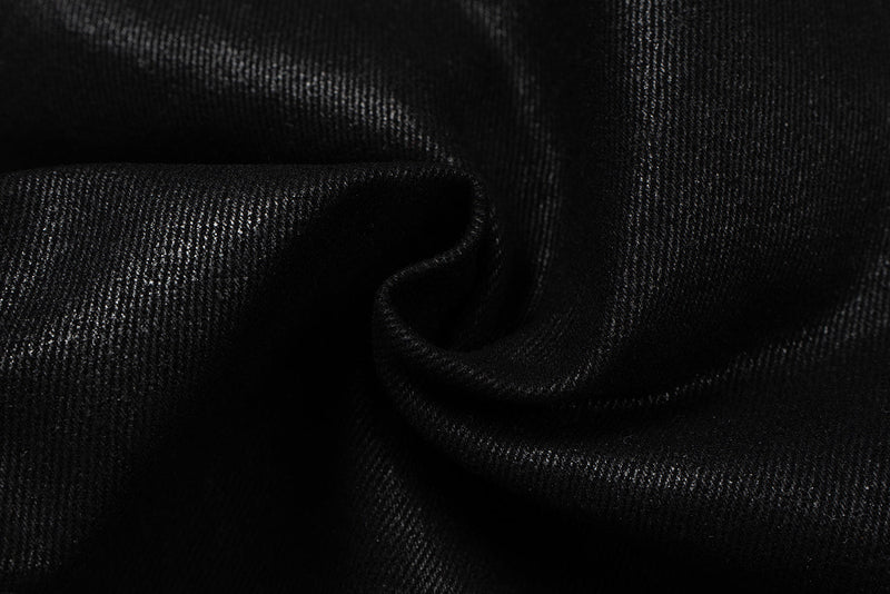 Close-up of black leather-effect fabric with a soft folded texture