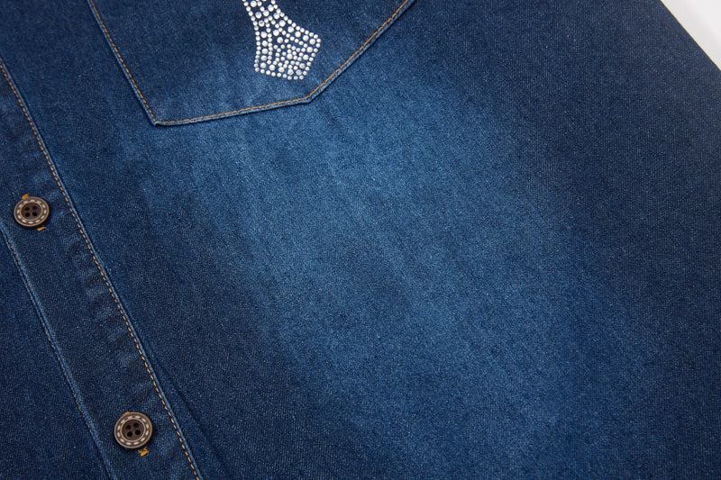 Blue denim button-up shirt with rhinestone cross detail and contrast stitching, streetwear style close-up