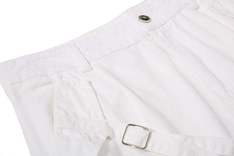 White shorts back waistband and pocket detail, angled close-up