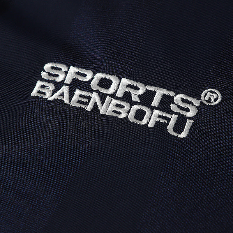 Close-up of navy performance soccer jersey fabric with embroidered Sports Baenboufu logo