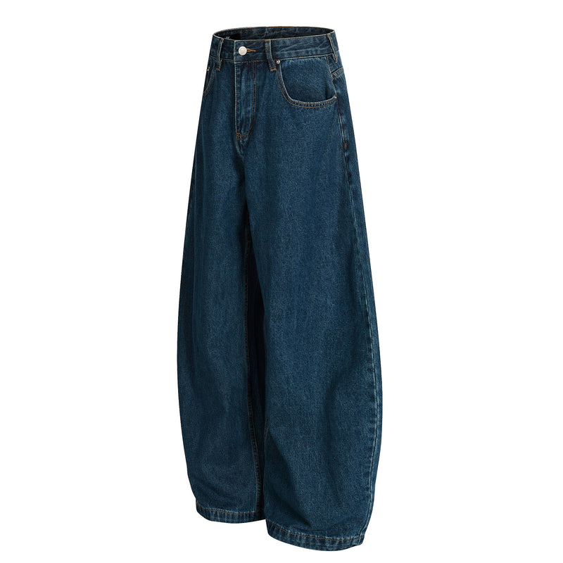 Deep indigo wide-leg jeans angled front view showing the loose balloon leg shape