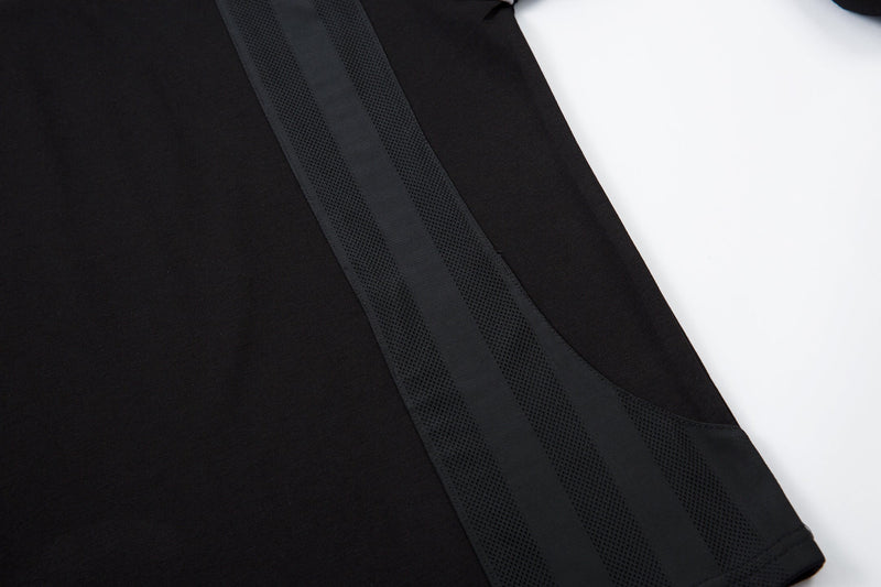 Black side panel with mesh insert detail on the raglan top