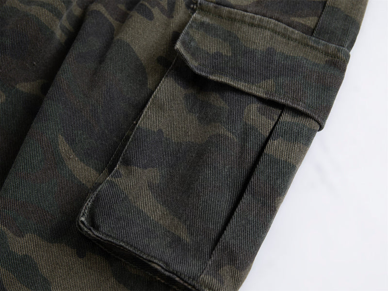 Close-up of side cargo pocket on dark camo pants