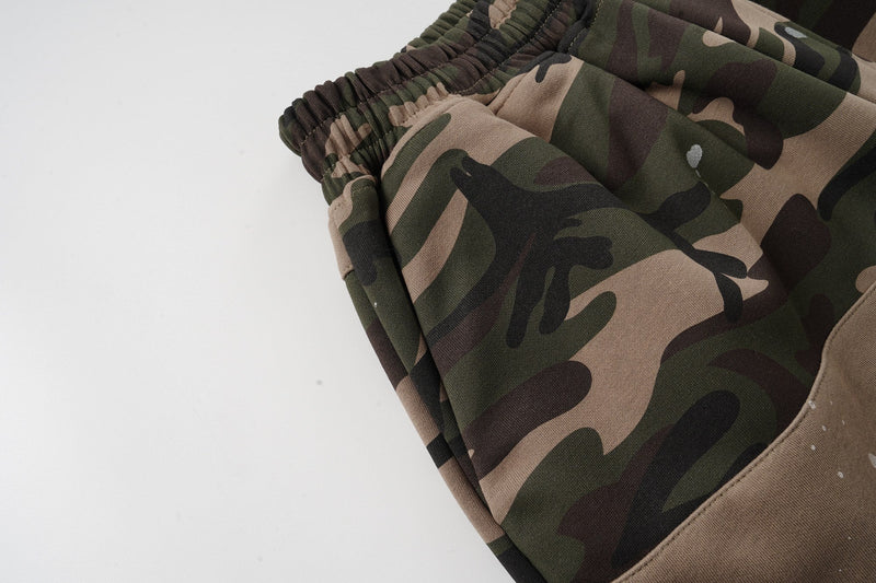 Close-up of camo fabric and elastic waist on baggy shorts