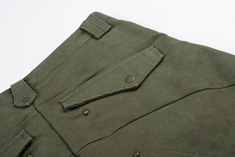 Close-up of army green pants back pocket flap with snap button