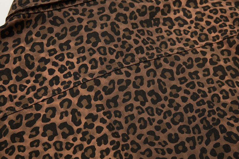 Close-up of a brown leopard print statement shirt with black spots and visible seam detail