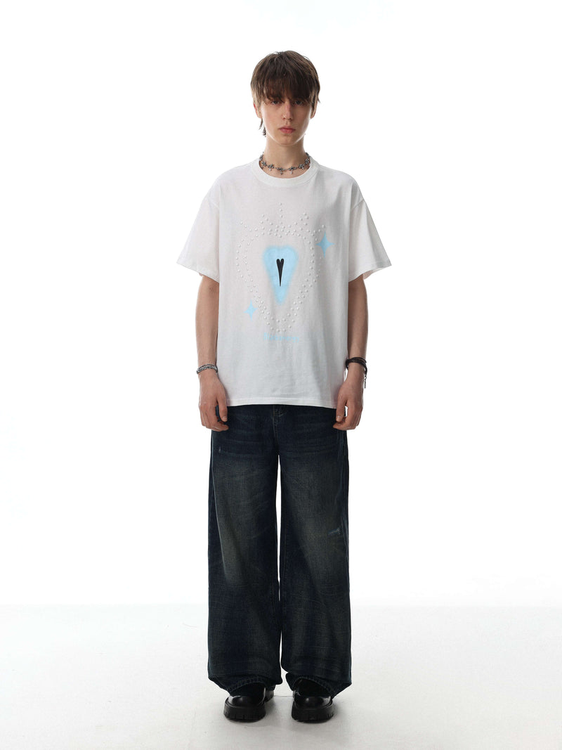 White oversized tee with rhinestone heart graphic and blue star accents on a model, Seakoff crystal design