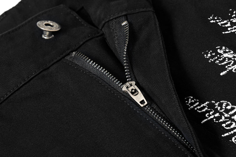 Close-up of black cargo pants zipper fly and waistband snap button