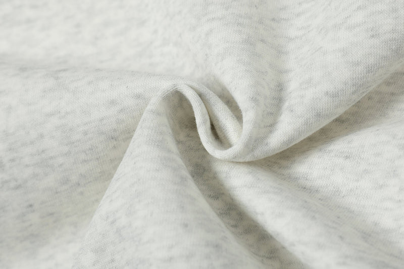 Close-up of light heather gray sweatshirt fabric texture and soft folds
