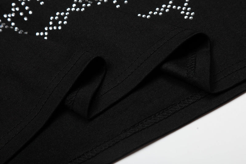 Black tee with rhinestone horse graphic and visible hem stitching on soft cotton fabric