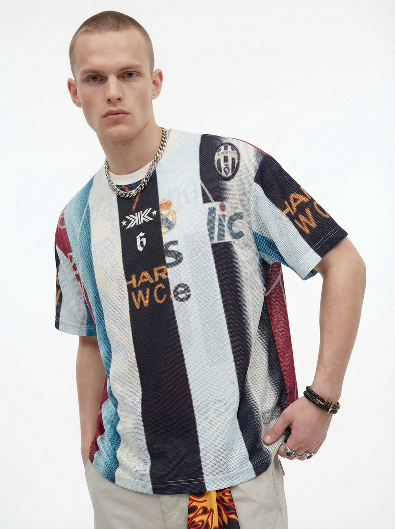 Model wearing a vintage patchwork football mesh jersey with bold striped graphics and streetwear styling