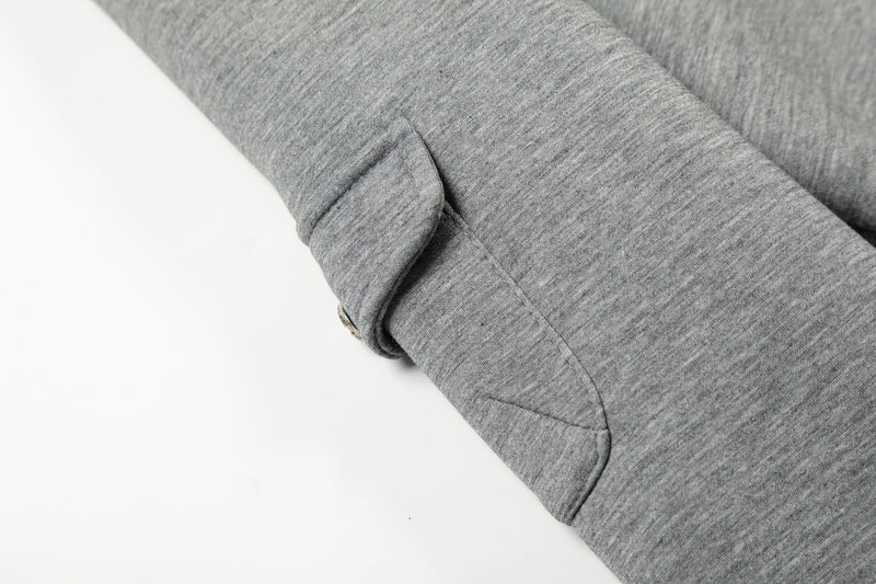 Close-up of grey sleeve cuff with seam detail