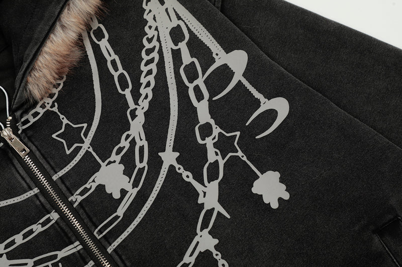 Close-up of black hoodie front with chain graphic, faux fur hood trim, and silver zipper