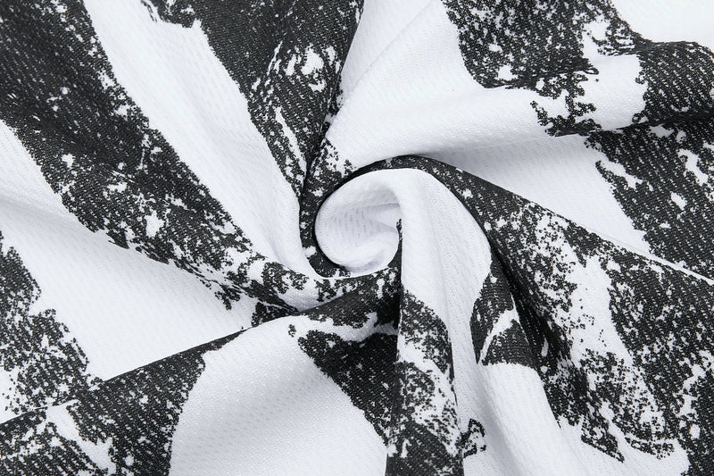 Close-up of white mesh jersey fabric with bold black gothic abstract print and textured sport tee pattern