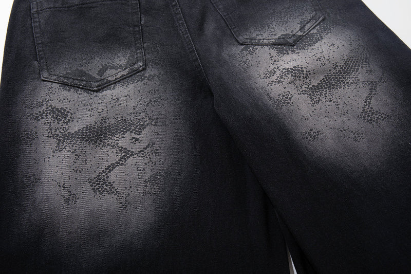 Close-up of rear pockets and camo wash on black denim