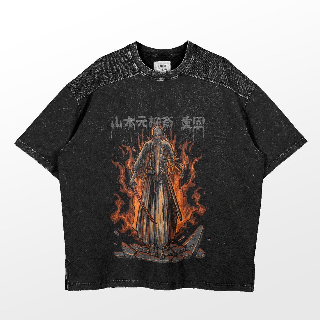 This Bleach shirt by the brand Bleach features a black cotton fabric with a graphic of a hooded figure holding a sword in vibrant orange flames and Japanese characters above, accented with speckled texture on the shoulders for an edgy touch.