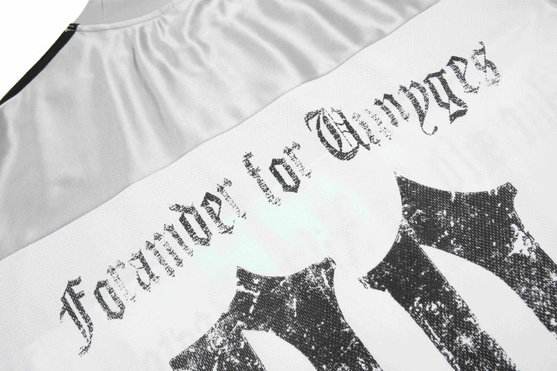 White mesh sport tee with distressed gothic Seakoff logo print across the chest, close-up on textured fabric